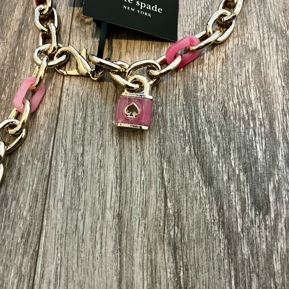 KATE SPADE NEW YORK LOCK & SPADE CHAIN LINK BELT IN PINK